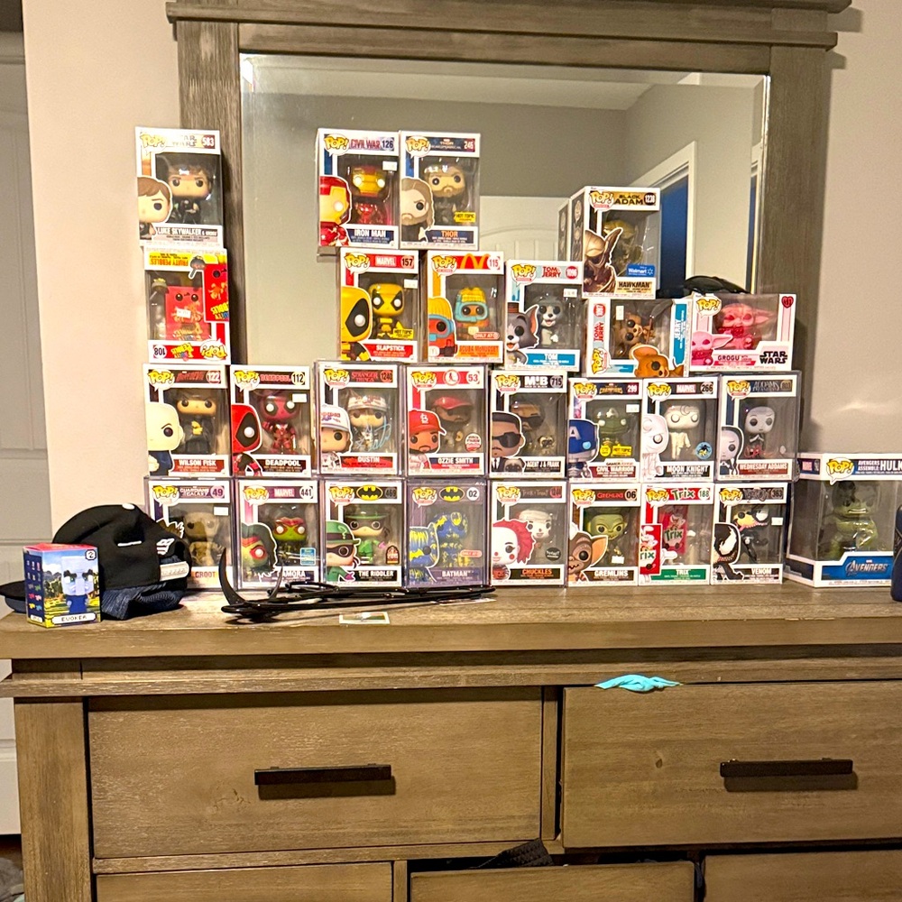 Funko Pop Vinyl Figures in Red, Yellow, and Blue